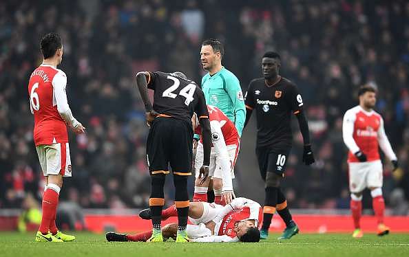 LONDON, ENGLAND - FEBRUARY 11: Francis Coquelin of Arsneal lies injured during the Premier League match between Arsenal and Hull City at Emirates Stadium on February 11, 2017 in London, England.  (Photo by Laurence Griffiths/Getty Images)