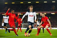 LIVERPOOL, ENGLAND - FEBRUARY 11: Christian Eriksen (C) of Tottenham Hotspur controls the ball under pressure of Georginio Wijnaldum (L) and Jordan Henderson (R) of Liverpool during the Premier League match between Liverpool and Tottenham Hotspur at Anfield on February 11, 2017 in Liverpool, England. (Photo by Clive Brunskill/Getty Images)