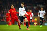 LIVERPOOL, ENGLAND - FEBRUARY 11: Eric Dier of Tottenham Hotspur controls the ball under pressure of Roberto Firmino of Liverpool during the Premier League match between Liverpool and Tottenham Hotspur at Anfield on February 11, 2017 in Liverpool, England. (Photo by Clive Brunskill/Getty Images)