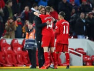 LIVERPOOL, ENGLAND - FEBRUARY 11: Jurgen Klopp, Manager of Liverpool hugs Jordan Henderson of Liverpool following victory during the Premier League match between Liverpool and Tottenham Hotspur at Anfield on February 11, 2017 in Liverpool, England. (Photo by Clive Brunskill/Getty Images)