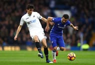 LONDON, ENGLAND - FEBRUARY 25: Jack Cork of Swansea City (L) and Pedro of Chelsea (R) battle for possession during the Premier League match between Chelsea and Swansea City at Stamford Bridge on February 25, 2017 in London, England. (Photo by Clive Rose/Getty Images)