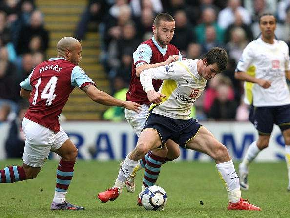 BURNLEY, ENGLAND - MAY 09 :   Gareth Bale of Tottenham Hotspur battles with Martin Paterson of Burnley during the Barclays Premier League match between Burnley and Tottenham Hotspur at Turf Moor on May 09, 2010 in Burnley, England.  (Photo by Jan Kruger/Getty Images)