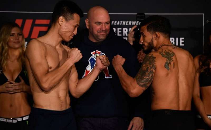 Chan Sung Jung and Dennis Bermudez at the weigh-in