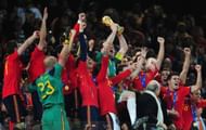 JOHANNESBURG, SOUTH AFRICA - JULY 11: Iker Casillas, captain of Spain (C), and the Spain team celebrate victory with the World Cup trophy during the 2010 FIFA World Cup South Africa Final match between Netherlands and Spain at Soccer City Stadium on July 11, 2010 in Johannesburg, South Africa. (Photo by Clive Mason/Getty Images)