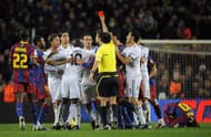 BARCELONA, SPAIN - NOVEMBER 29: Sergio Ramos (3thL) is shown the red card by referee Iturralde Gonzalez during the La Liga match between Barcelona and Real Madrid at the Camp Nou Stadium on November 29, 2010 in Barcelona, Spain. Barcelona won the match 5-0. (Photo by David Ramos/Getty Images)