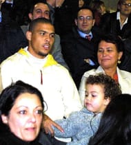 19 Mar 2002: Ronaldo and his son watch his wife Milene Dominguez in action during the friendly match between Monza and Region 4, a representative side from the West Coast of America. DIGITAL IMAGE Mandatory Credit: Grazia Neri/Getty Images