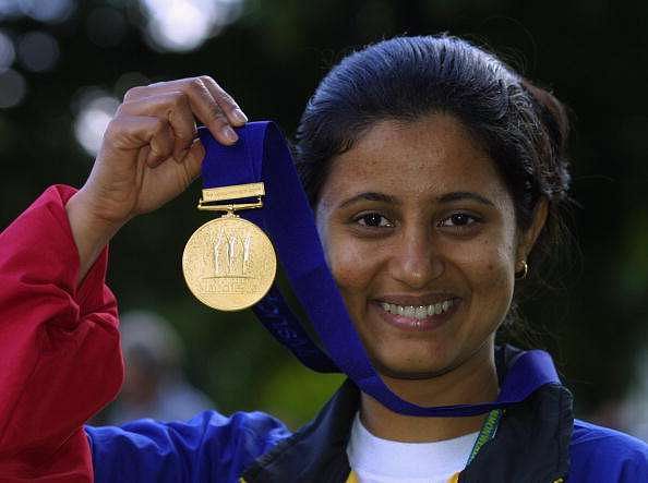 BISLEY - AUGUST 2:   Anjali Bhagwat of India celebrates winning gold in the Women&#039;s 50m Rifle 3 Positions Singles Competition (her fourth gold of the Games) during the 2002 Commonwealth Games in Bisley, England on August 2, 2002. (Photo by Craig Prentis/Getty Images) 