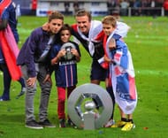 PARIS, FRANCE - MAY 18: David Beckham poses wih the Ligue 1 trophy and his sons, Brooklyn, Romeo and Cruz during the Ligue 1 match between Paris Saint-Germain FC and Stade Brestois 29 at Parc des Princes on May 18, 2013 in Paris, France. (Photo by Michael Regan/Getty Images)
