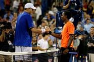 NEW YORK, NY - AUGUST 29: John Isner of the United States of America shakes hands at the net with Gael Monfils of France after their men's singles second round match on Day Four of the 2013 US Open at USTA Billie Jean King National Tennis Center on August 29, 2013 in the Flushing neighborhood of the Queens borough of New York City. (Photo by Matthew Stockman/Getty Images)