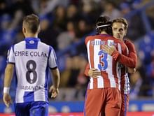 Griezmann earns Atletico draw, Torres carried off