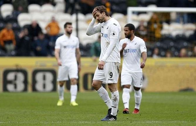 Hull and Bournemouth strike blows in relegation battle