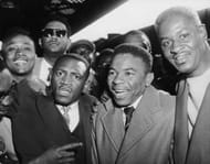 West Indies batsman Collie Smith (1933 - 1959), centre, receives an enthusiastic welcome as the team arrive at Waterloo Station, 14th April 1957. (Photo by Fred Ramage/Keystone/Getty Images)