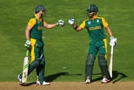 WELLINGTON, NEW ZEALAND - MARCH 12: AB de Villiers (L) and JP Duminy of South Africa bump fists while batting during the 2015 ICC Cricket World Cup match between South Africa and the United Arab Emirates at Wellington Regional Stadium on March 12, 2015 in Wellington, New Zealand. (Photo by Hagen Hopkins/Getty Images)