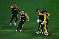 AUCKLAND, NEW ZEALAND - MARCH 24: Francois du Plessis of South Africa, Imran Tahir of South Africa, Hashim Amla of South Africa, AB de Villiers of South Africa and Quinton de Kock of South Africa celebrate the wicket of Martin Guptill of New Zealand during the 2015 Cricket World Cup Semi Final match between New Zealand and South Africa at Eden Park on March 24, 2015 in Auckland, New Zealand. (Photo by Hannah Peters/Getty Images)