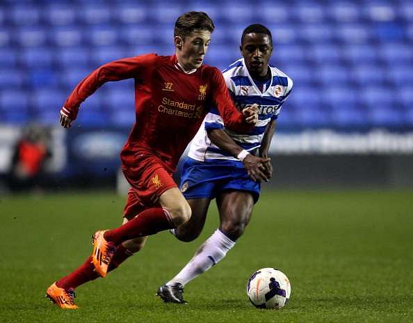 READING, ENGLAND - MARCH 12: Harry Wilson of Liverpool holds off pressure from Tarique Fosu of Reading during the FA Youth Cup 6th Round match between Reading U18 and Liverpool U18 at Madejski Stadium on March 12, 2014 in Reading, England.  (Photo by Ben Hoskins/Getty Images)