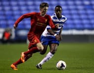 READING, ENGLAND - MARCH 12: Harry Wilson of Liverpool holds off pressure from Tarique Fosu of Reading during the FA Youth Cup 6th Round match between Reading U18 and Liverpool U18 at Madejski Stadium on March 12, 2014 in Reading, England. (Photo by Ben Hoskins/Getty Images)