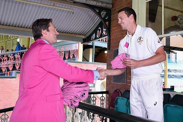 SYDNEY, AUSTRALIA - JANUARY 05: Josh Hazlewood of Australia presents former Australian bowler Glenn McGrath with his Pink Cap on Jane McGrath Day during day three of the third Test match between Australia and the West Indies at Sydney Cricket Ground on January 5, 2016 in Sydney, Australia.  (Photo by Cameron Spencer/Getty Images)
