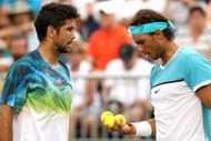 KEY BISCAYNE, FL - MARCH 24: Fernando Verdasco and Rafael Nadal of Spain confer between points while playing Simone Bolelli and Andreas Seppi of Italy during the Miami Open presented by Itau at Crandon Park Tennis Center on March 24, 2016 in Key Biscayne, Florida. (Photo by Matthew Stockman/Getty Images)