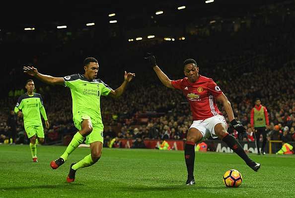 MANCHESTER, ENGLAND - JANUARY 15:  Anthony Martial of Manchester United is faced by Trent Alexander-Arnold of Liverpool during the Premier League match between Manchester United and Liverpool at Old Trafford on January 15, 2017 in Manchester, England.  (Photo by Mike Hewitt/Getty Images)