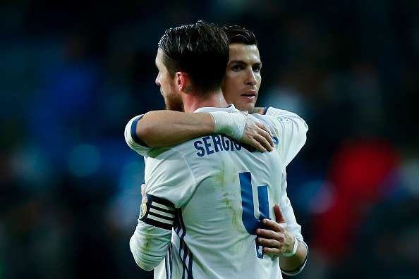 MADRID, SPAIN - JANUARY 29: Cristiano Ronaldo (R) of Real Madrid CF hugs his teammate Sergio Ramos (L) after the La Liga match between Real Madrid CF and Real Sociedad de Futbol at Estadio Santiago Bernabeu on January 29, 2017 in Madrid, Spain. (Photo by Gonzalo Arroyo Moreno/Getty Images)