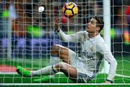 MADRID, SPAIN - MARCH 01: Cristiano Ronaldo of Real Madrid CF picks the ball after scoring their second goal during the La Liga match between Real Madrid CF and UD Las Palmas at Estadio Santiago Bernabeu on March 1, 2017 in Madrid, Spain. (Photo by Gonzalo Arroyo Moreno/Getty Images)