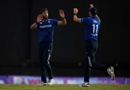ST JOHNS, ANTIGUA - MARCH 03: Liam Plunkett of England celebrates with Steven Finn after dismissing Jonathan Carter of the West Indies during the first One Day International between the West Indies and England at Sir Vivian Richards Cricket Ground on March 3, 2017 in St Johns, Antigua. (Photo by Gareth Copley/Getty Images)