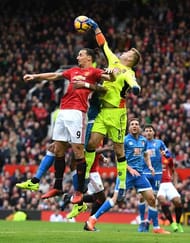 MANCHESTER, ENGLAND - MARCH 04: Artur Boruc of AFC Bournemouth (R) attempts to punch the ball away while Zlatan Ibrahimovic of Manchester United (L) attempts to head the ball towards goal during the Premier League match between Manchester United and AFC Bournemouth at Old Trafford on March 4, 2017 in Manchester, England. (Photo by Shaun Botterill/Getty Images)