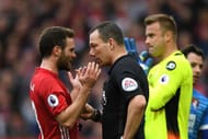 MANCHESTER, ENGLAND - MARCH 04: Juan Mata of Manchester United (L) speaks to referee Kevin Friend (R) during the Premier League match between Manchester United and AFC Bournemouth at Old Trafford on March 4, 2017 in Manchester, England. (Photo by Shaun Botterill/Getty Images)