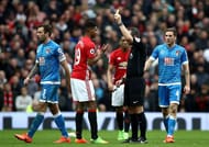 MANCHESTER, ENGLAND - MARCH 04: Marcus Rashford of Manchester United (L) is shown a yellow card by referee Kevin Friend during the Premier League match between Manchester United and AFC Bournemouth at Old Trafford on March 4, 2017 in Manchester, England. (Photo by Julian Finney/Getty Images)