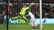 SWANSEA, WALES - MARCH 04: Fernando Llorente of Swansea City (R) scores his sides third goal past Paul Robinson of Burnley (L) during the Premier League match between Swansea City and Burnley at Liberty Stadium on March 4, 2017 in Swansea, Wales. (Photo by Ben Hoskins/Getty Images)