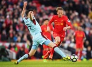 LIVERPOOL, ENGLAND - MARCH 12: Michael Keane of Burnley (L) attempts to tackle Lucas Leiva of Liverpool (C) during the Premier League match between Liverpool and Burnley at Anfield on March 12, 2017 in Liverpool, England. (Photo by Michael Regan/Getty Images)