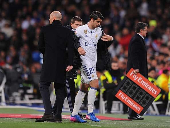 MADRID, SPAIN - MARCH 12: Alvaro Morata of Real Madrid walks past his head coach Zinedine Zidane after coming off during the La Liga match between Real Madrid CF and Real Betis Balompie at Estadio Santiago Bernabeu on March 12, 2017 in Madrid, Spain. (Photo by Denis Doyle/Getty Images)