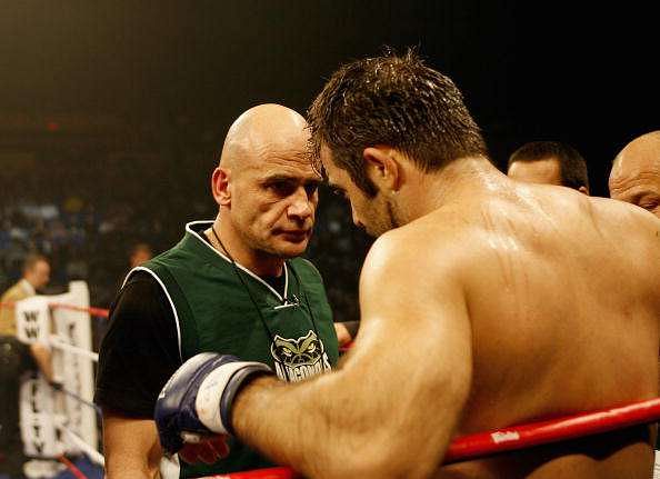 PORTLAND OR - NOVEMBER 2: Alex Schoenauer of the Anacondas speaks with his coach (L) Bas Rutten after his loss to Aaron Stark of the Wolfpack fights  at the  IFL World Team Semi-Final Championship at Memorial Coliseum  on November 2, 2006 in Portland, Oregon. (Photo by Tom Hauck/Getty Images for IFL)
