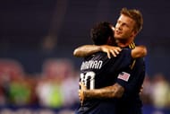 EAST RUTHERFORD, NJ - JULY 16: (L-R) Landon Donovan #10 and David Beckham #23 of the LA Galaxy celebrate a goal in the first half by teammate Eddie Lewis #6 during the game against the New York Red Bulls at Giants Stadium in the Meadowlands on July 16, 2009 in East Rutherford, New Jersey. (Photo by Chris McGrath/Getty Images)