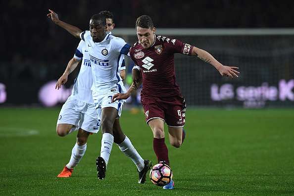 TURIN, ITALY - MARCH 18:  Andrea Belotti (R) of FC Torino is challenged by Geoffrey Kondogbia of FC Internazionale during the Serie A match between FC Torino and FC Internazionale at Stadio Olimpico di Torino on March 18, 2017 in Turin, Italy.  (Photo by Valerio Pennicino/Getty Images)