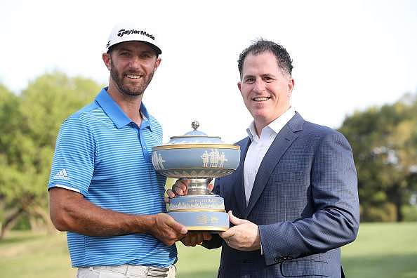 AUSTIN, TX - MARCH 26: Dustin Johnson (L) and the CEO of Dell Michael Dell pose with the trophy after the World Golf Championships-Dell Technologies Match Play at the Austin Country Club on March 26, 2017 in Austin, Texas. (Photo by Christian Petersen/Getty Images)