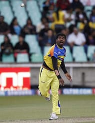 DURBAN, SOUTH AFRICA - SEPTEMBER 24: Muttiah Muralitharan warms up before the Airtel Champions League Twenty20 semi final match between Chennai Super Kings and Royal Challengers Bangalore at Sahara Stadium Kingsmead on September 24, 2010 in Durban, South Africa. (Photo by Anesh Debiky/Gallo Images/Getty Images)