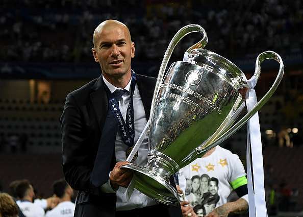 MILAN, ITALY - MAY 28:  Real Madrid head coach Zinedine Zidane shows the trophy after winning the UEFA Champions League Final match between Real Madrid and Club Atletico de Madrid at Stadio Giuseppe Meazza on May 28, 2016 in Milan, Italy.  (Photo by Matthias Hangst/Getty Images)