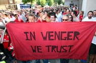 Supporters of Arsene Wenger