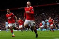 MANCHESTER, ENGLAND - FEBRUARY 12: Wayne Rooney of Manchester United celebrates with teammate Nani (L) after he scores a goal from an overhead kick during the Barclays Premier League match between Manchester United and Manchester City at Old Trafford on February 12, 2011 in Manchester, England. (Photo by Alex Livesey/Getty Images)