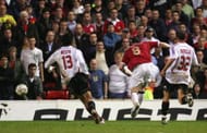 MANCHESTER, UNITED KINGDOM - APRIL 24: Wayne Rooney of Manchester United scores his team's third goal during the UEFA Champions League Semi Final, first leg match between Manchester United and AC Milan at Old Trafford on April 24, 2007 in Manchester, England. (Photo by Laurence Griffiths/Getty Images)