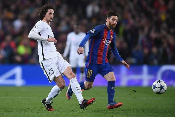 BARCELONA, SPAIN - MARCH 08: Adrien Rabiot of PSG in action with Lionel Messi during the UEFA Champions League Round of 16 second leg match between FC Barcelona and Paris Saint-Germain at Camp Nou on March 8, 2017 in Barcelona, Spain.  (Photo by Michael Regan/Getty Images)