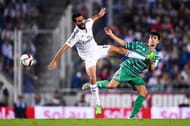 BARCELONA, SPAIN - OCTOBER 29: Alvaro Arbeloa of Real Madrid CF competes for the ball with Xemi of Cornella during the Copa Del Rey Round of 32 first leg match at Power8 Stadium on October 29, 2014 in Barcelona, Spain. (Photo by David Ramos/Getty Images)