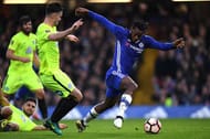 LONDON, ENGLAND - JANUARY 08: Andrew Hughes of Peterborough United (L) attempts to tackle Michy Batshuayi of Chelsea (R) during The Emirates FA Cup Third Round match between Chelsea and Peterborough United at Stamford Bridge on January 8, 2017 in London, England. (Photo by Shaun Botterill/Getty Images)