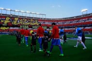 MADRID, SPAIN - APRIL 12: Atletico de Madrid (L) and Leicester City FC (R) players entesr to the pitch prior to start the UEFA Champions League Quarter Final first leg match between Club Atletico de Madrid and Leicester City at Vicente Calderon Stadium on April 12, 2017 in Madrid, Spain. (Photo by Gonzalo Arroyo Moreno/Getty Images)