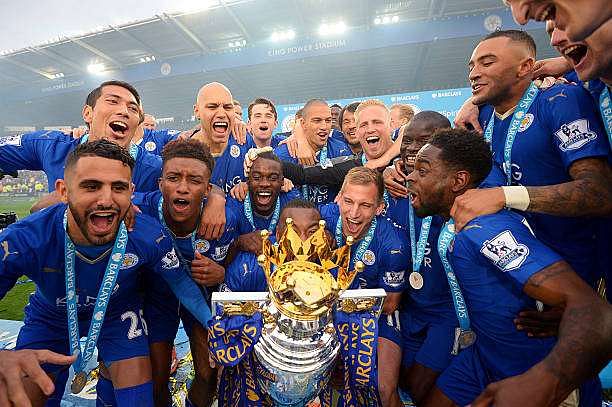 LEICESTER, ENGLAND - MAY 07:  Captain Wes Morgan of Leicester City to lift the Premier League Trophy as players celebrate the season champions after the Barclays Premier League match between Leicester City and Everton at The King Power Stadium on May 7, 2016 in Leicester, United Kingdom.  (Photo by Michael Regan/Getty Images)