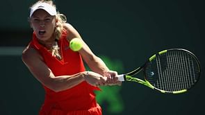 Wozniacki into last eight as Stosur loses