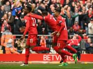 LIVERPOOL, ENGLAND - APRIL 01: Divock Origi of Liverpool (L) celebrates scoring his sides third goal with his Liverpool team mates during the Premier League match between Liverpool and Everton at Anfield on April 1, 2017 in Liverpool, England. (Photo by Gareth Copley/Getty Images)