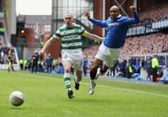 GLASGOW, SCOTLAND - FEBRUARY 06: El Hadji Diouf of Rangers tackles Scott Brown of Celtic during the Scottish Cup 5th round match between Rangers and Celtic at Ibrox Stadium on February 6, 2011 in Glasgow, Scotland. (Photo by Jeff J Mitchell/Getty Images)