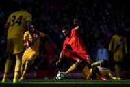 LIVERPOOL, ENGLAND - APRIL 23: Emre Can of Liverpool is tackled by Jason Puncheon of Crystal Palace during the Premier League match between Liverpool and Crystal Palace at Anfield on April 23, 2017 in Liverpool, England. (Photo by Laurence Griffiths/Getty Images)